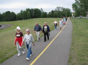Group of people walking on a trail